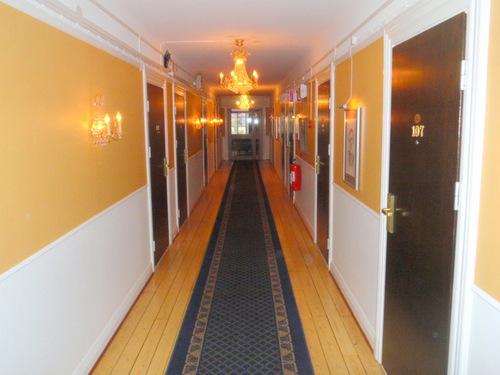 Motel's Classic Wood Hallway.